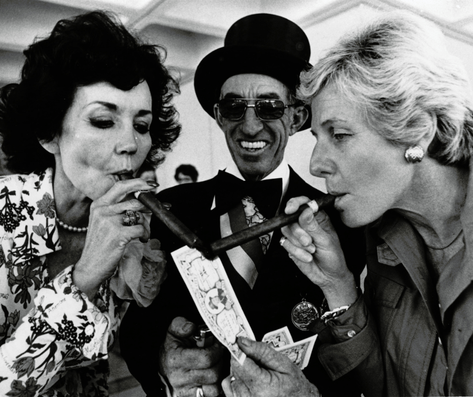 Representatives Helen Gordon Davis and Pat Frank get their cigars lit by the "Alcalde" of Ybor City. (Image courtesy of the Donn Dughi Collection, State Archives of Florida)