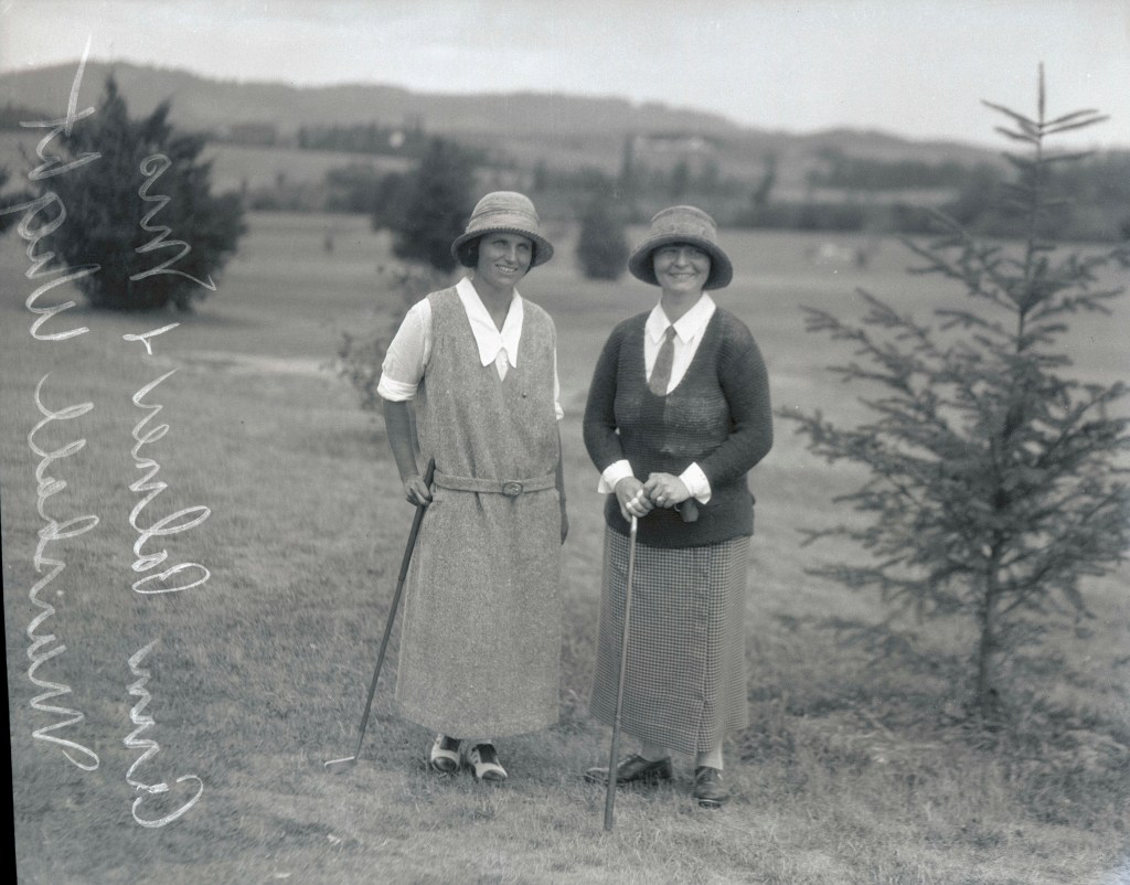 Image shows Ann Palmer and Mrs. Marshall Wright posing with golf clubs (image courtesy of the Oregon Journal Negative Collection)