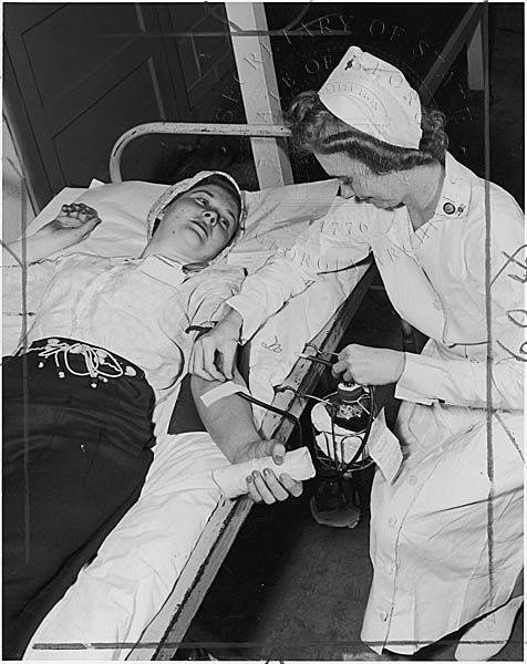 Image shows a woman donating blood through the Red Cross
(Image courtesy of the Lamar Q. Ball Collection, Georgia Archive)
