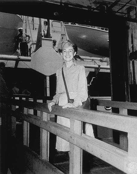 Image shows a woman standing on a the gangway of a large ship (image courtesy of the U.S. Army Signal Corps Photograph Collection, Library of Virginia)
