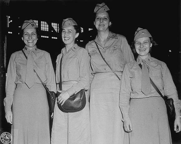 Image shows a group of women standing beside one another on the gangway of a ship (image courtesy of the U.S. Army Signal Corps Photograph Collection, Library of Virginia)